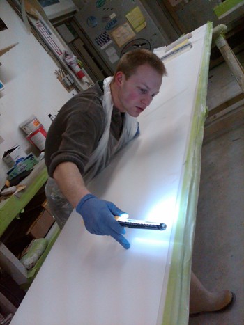 Andy Brayer, sanding Concordia panels